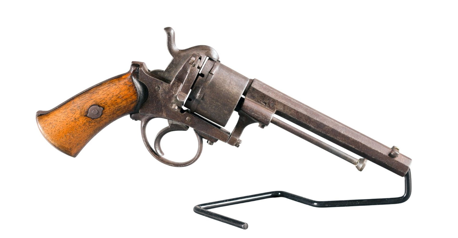 Belgian pinfire revolver, 9mm: [Antique Firearm] An antique Belgian pinfire double action 6 shot revolver, 9mm. Blued finish. 4 3/4" barrel. Leige proofed cylinder. Wood grips. 9 1/2" Condition: Fair condition. Dark patina across m