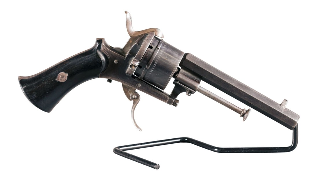 Belgian pinfire revolver, 8.5mm: [Antique Firearm] A LeFacheaux style Belgian pinfire double action 6 shot revolver, 8.5mm. Blued finish. 4 1/8" octagon barrel. Marked "ACHR PONDU?" Liege proofs on cylinder. Dark stained wood grips. 