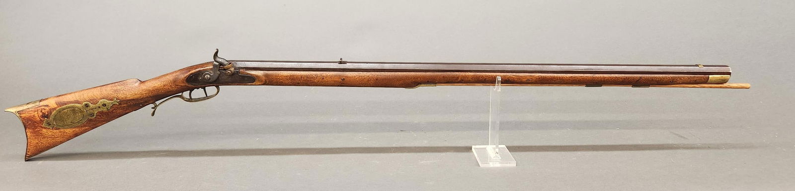 Pennsylvania Kentucky percussion rifle, .45 cal.: [Antique Firearm] A Pennsylvania Kentucky percussion long rifle, .45 caliber. 19th Century,. 35" octagon barrel with rear buckhorn and missing front sight. Obscured markings. Curly maple full length s