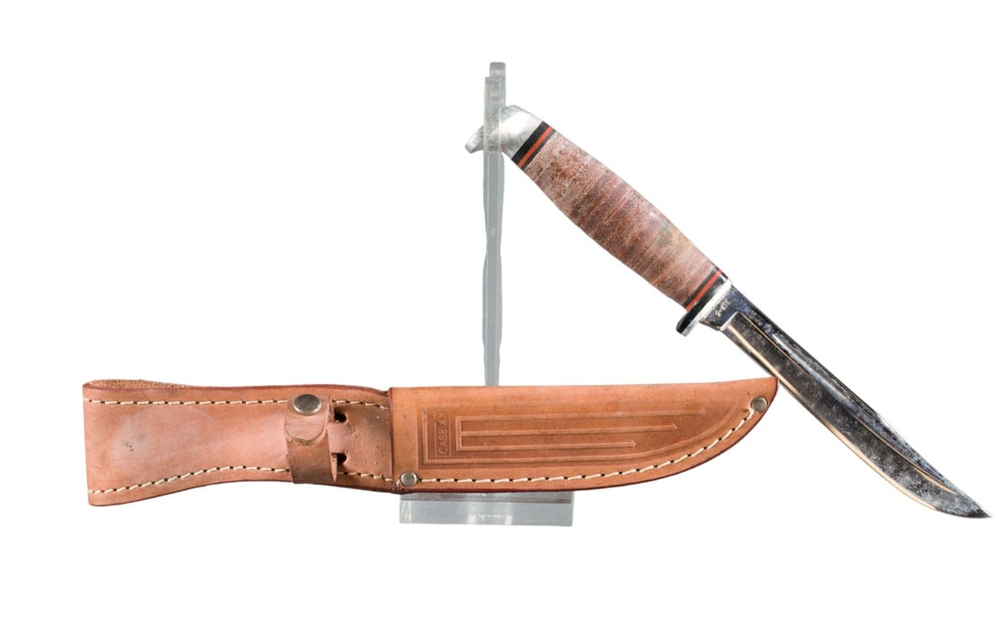 Case XX 316-5 hunting knife: A Case XX 316-5 hunting knife. Circa 1965-67. 5" blade. Stacked Leather Handle. Original scabbard. 9 1/4" overall. Condition: Fading of handle and scabbard.