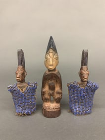 3 Nigerian figures.