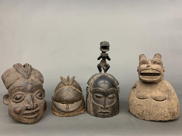 4 West African head masks.