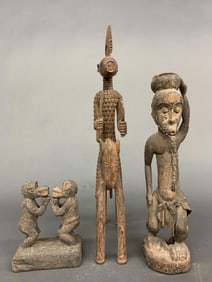 3 West African figures.