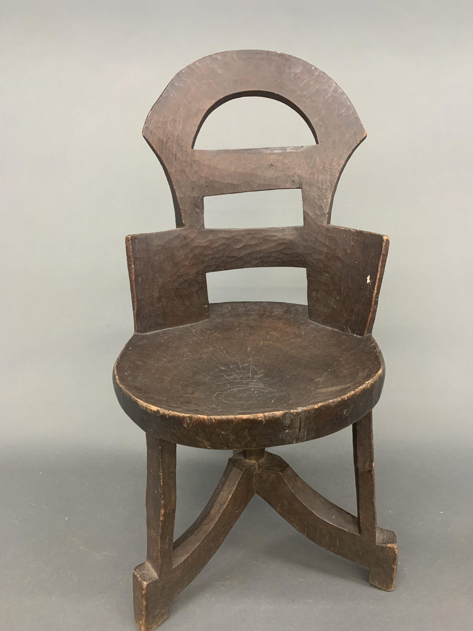 Ethiopian chair.: An Ethiopian chair. Wood. 34 1/2" x 18". Condition: Abrasions, wear. Provenance: From the estate of Dianne Komminsk to benefit the Dayton Art Institute.