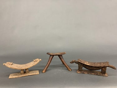3 African neckrests.