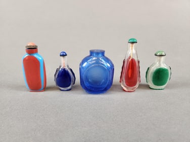5 Glass snuff bottles.