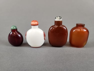 4 Glass snuff bottles.