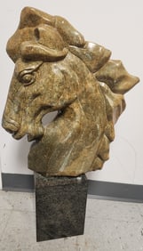 Carved stone horse head