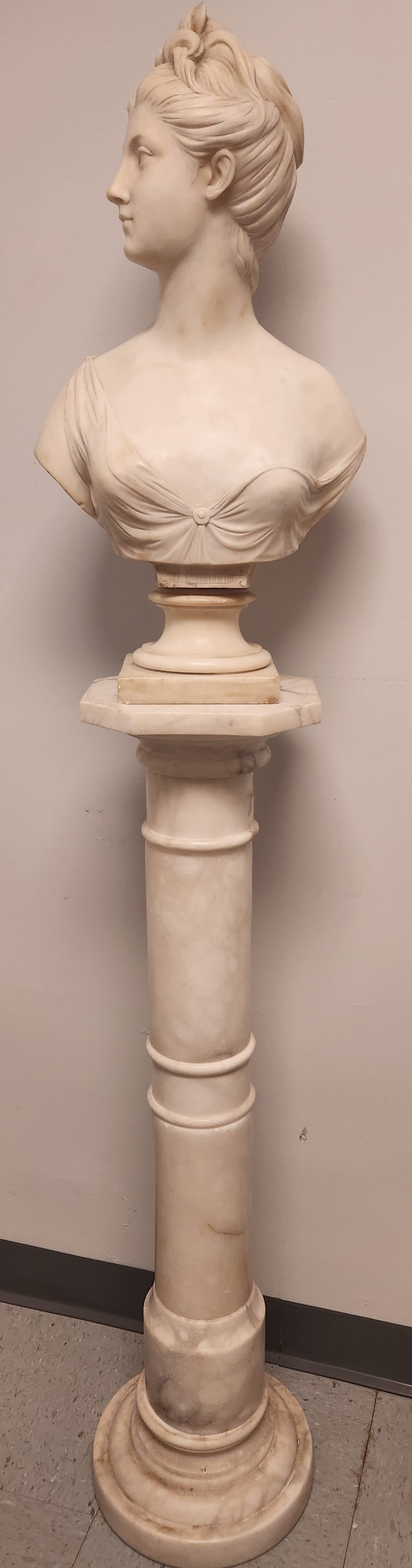 After J. Houdon marble bust of Diana: After Jean-Antoine Houdon (France, 1741-1828) marble bust of Diana with marble pedestal. Signed on reverse "HOUDON." Bust: 25" x 13 1/2" Pedestal: 30 1/4" tall. Condition: Damage to top of hair.