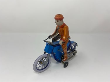 Motorcycle wind up toy.