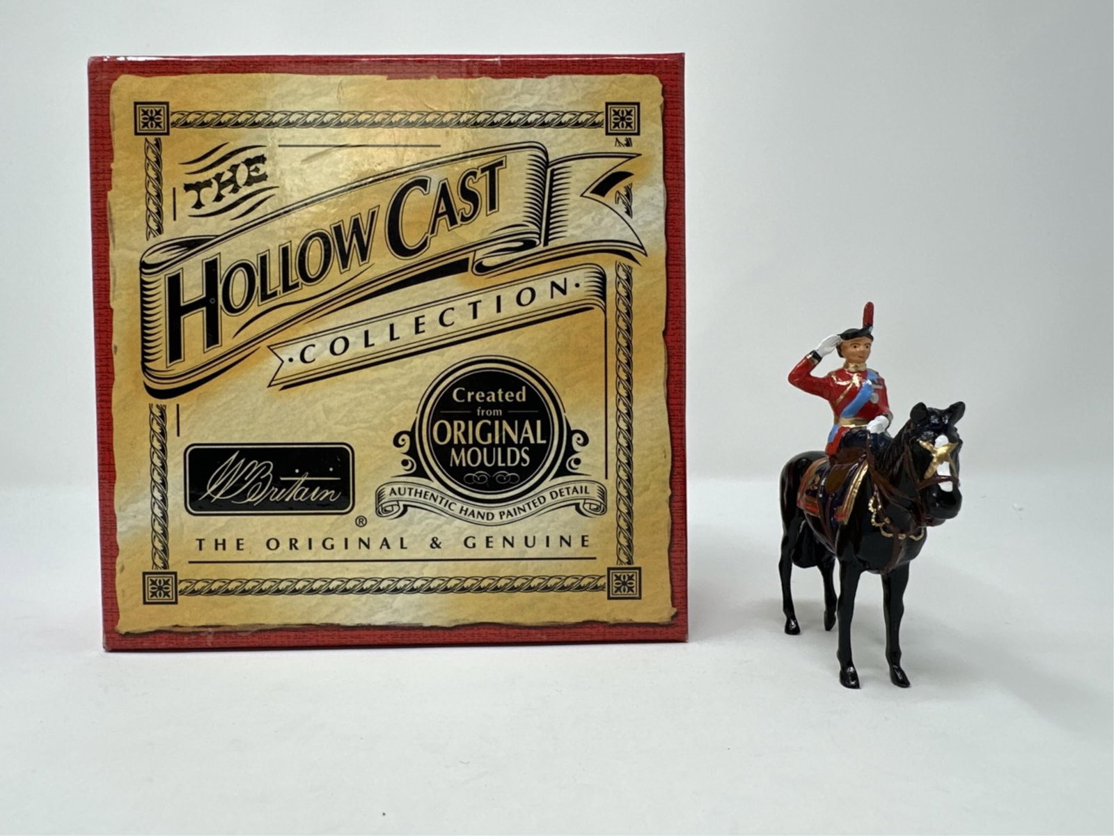 W Britain, Her Majesty the Queen on Burmese.: A W Britain Hollow Cast Collection toy soldier. Her Majesty The Queen on Burmese. Number 40197.