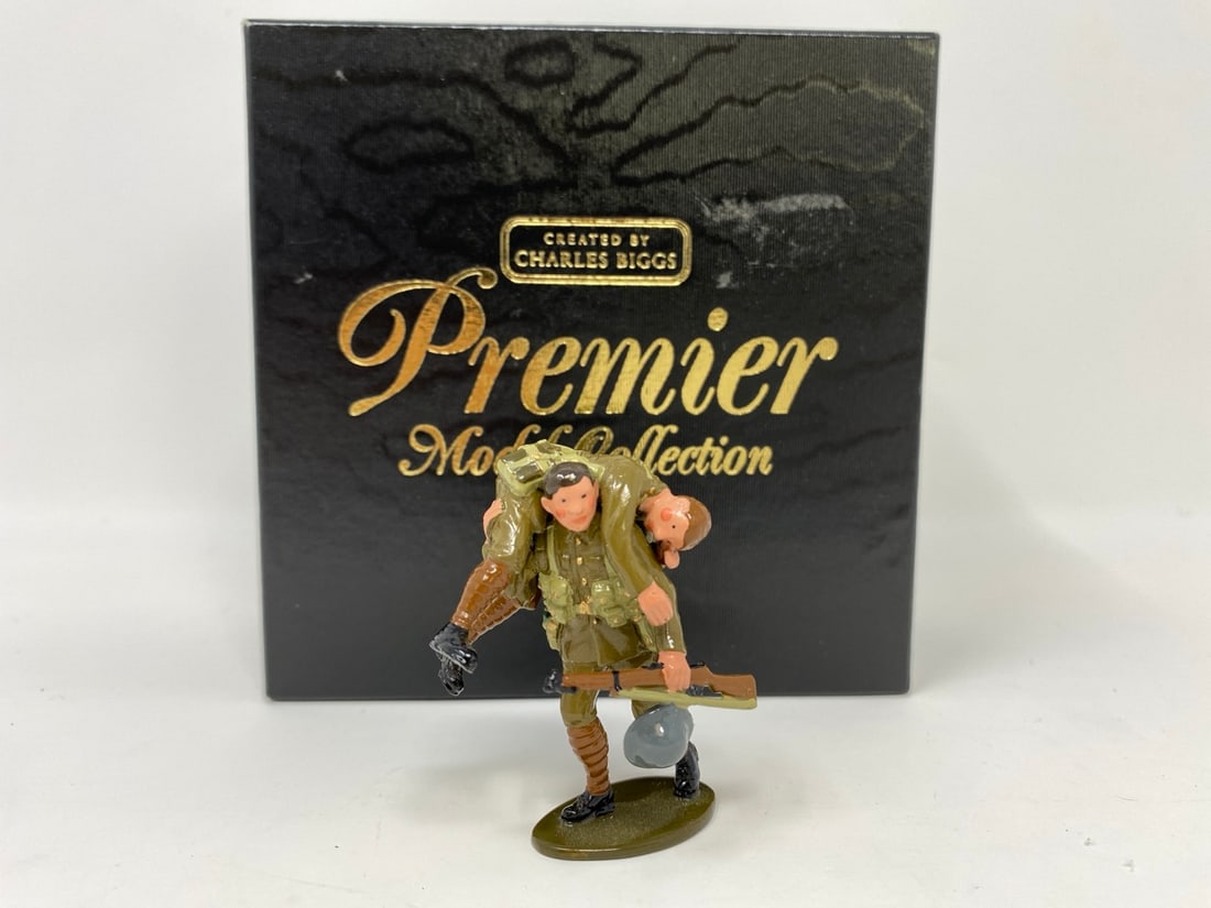 W Britain, Wounded man figure: A W Britain Premier Model Collection toy soldier. No. 2005 Wounded man being carried