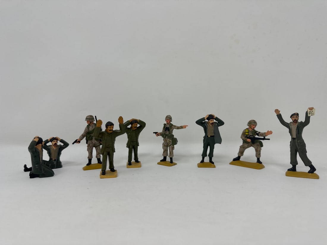 9 Toy Soldiers: A set of nine toy soldiers. Operation Desert Storm, Marines and Iraqi Soldiers.