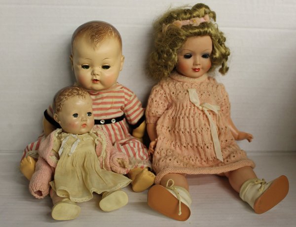 Group of 3 mid-century dolls, composition, rubber. Grou: Group of 3 dolls includes Dreil-M (MMM) German composition child doll 17", unmarked jointed composition baby doll with original clothing 10", and jointed hard rubber baby doll 15" marked on back of ne
