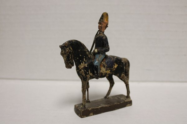 Lineol toy soldier, horse and mounted rider. Made in Ge: Made in Germany. c.1920s. Mounted figure 3 1/2". Horse 4". Condition: Paint loss.