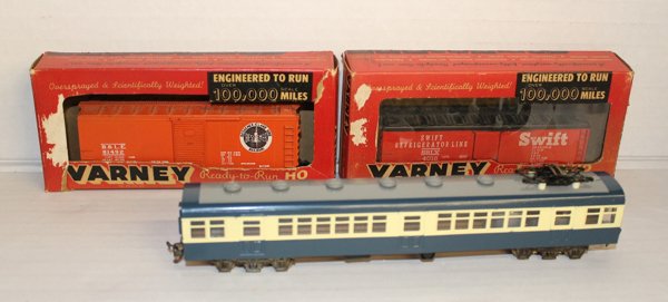 Group of assorted trains incl Varney Ready-to-Run. Incl: Includes 2 Varney Ready-to-Run HO new in box ("Box Car Single Door Bessemer & Lake Erie" and "Swift Refrigerator Line SLRX") and 10" long unmarked passenger train on blue and white.