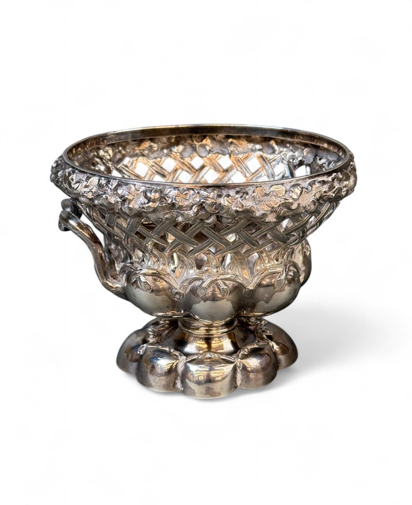 French Empire A. Debain silver compote.: A French Empire Alphonse Debain (Active 1883-1911) silver compote. Circa 1911-1916. Foliate and acorn rim over pierced latticework with gadrooned body and foot. Marked "DEBAIN" topped by a rowboat dia