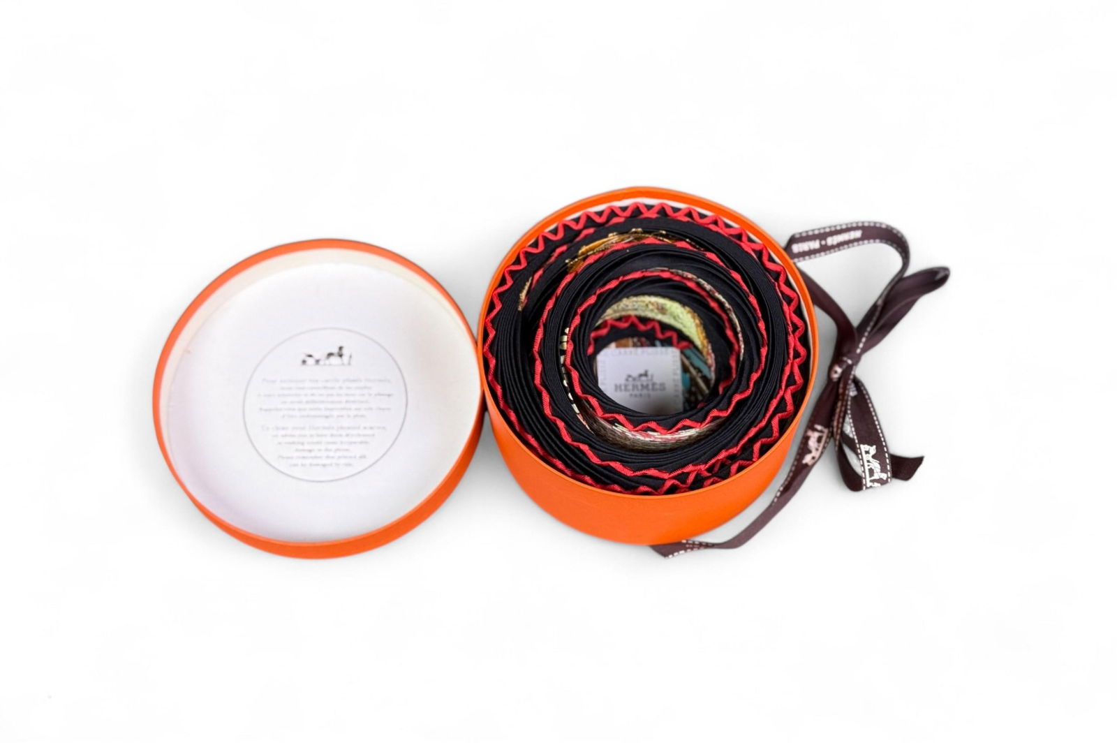 Hermes "Ombres et Lumieres" pleated scarf.: A Hermes "Ombres et Lumieres" pleated silk scarf. With original box. 35" x 35".