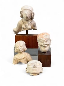 4 Pre-Columbian head fragments.
