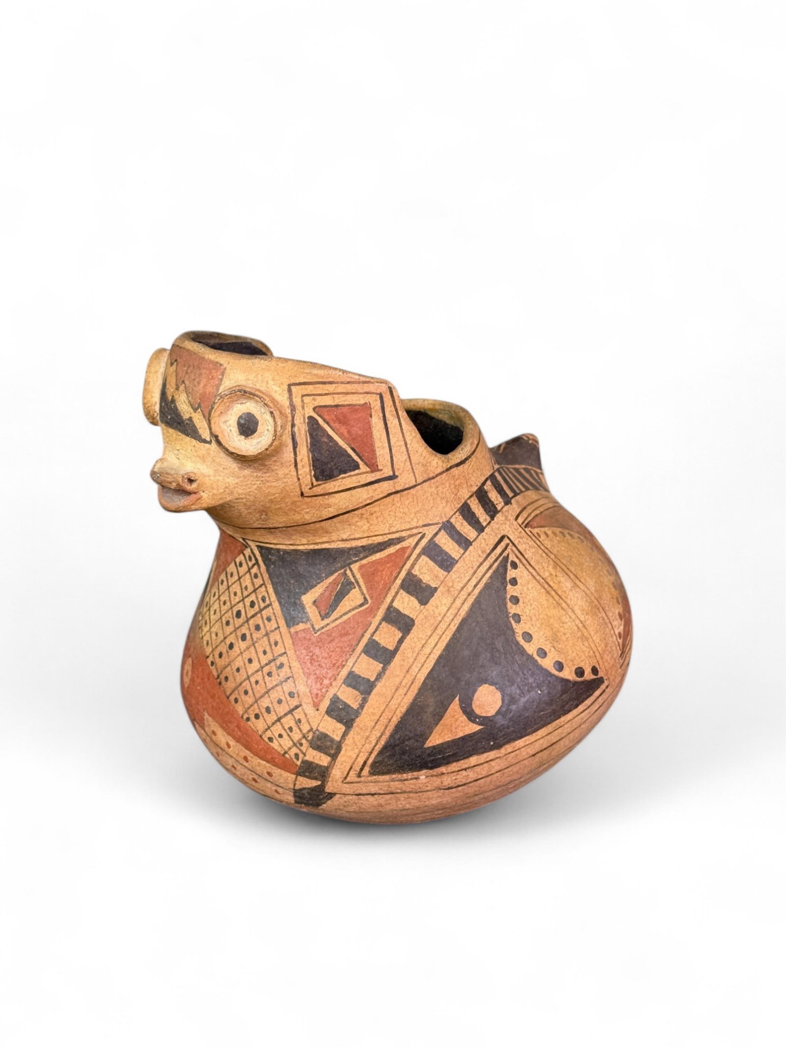 Casas Grandes figural olla, Mexico.: A Casas Grandes figural olla decorated with a face and geometrical patterns. Ceramic. Mexico. 7" x 6 1/2". Condition: Pigment loss, some loss on face and on bottom, and small cracks. Provenance: From 