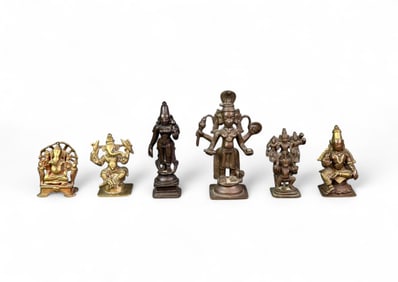 Six bronze and brass deity figures.