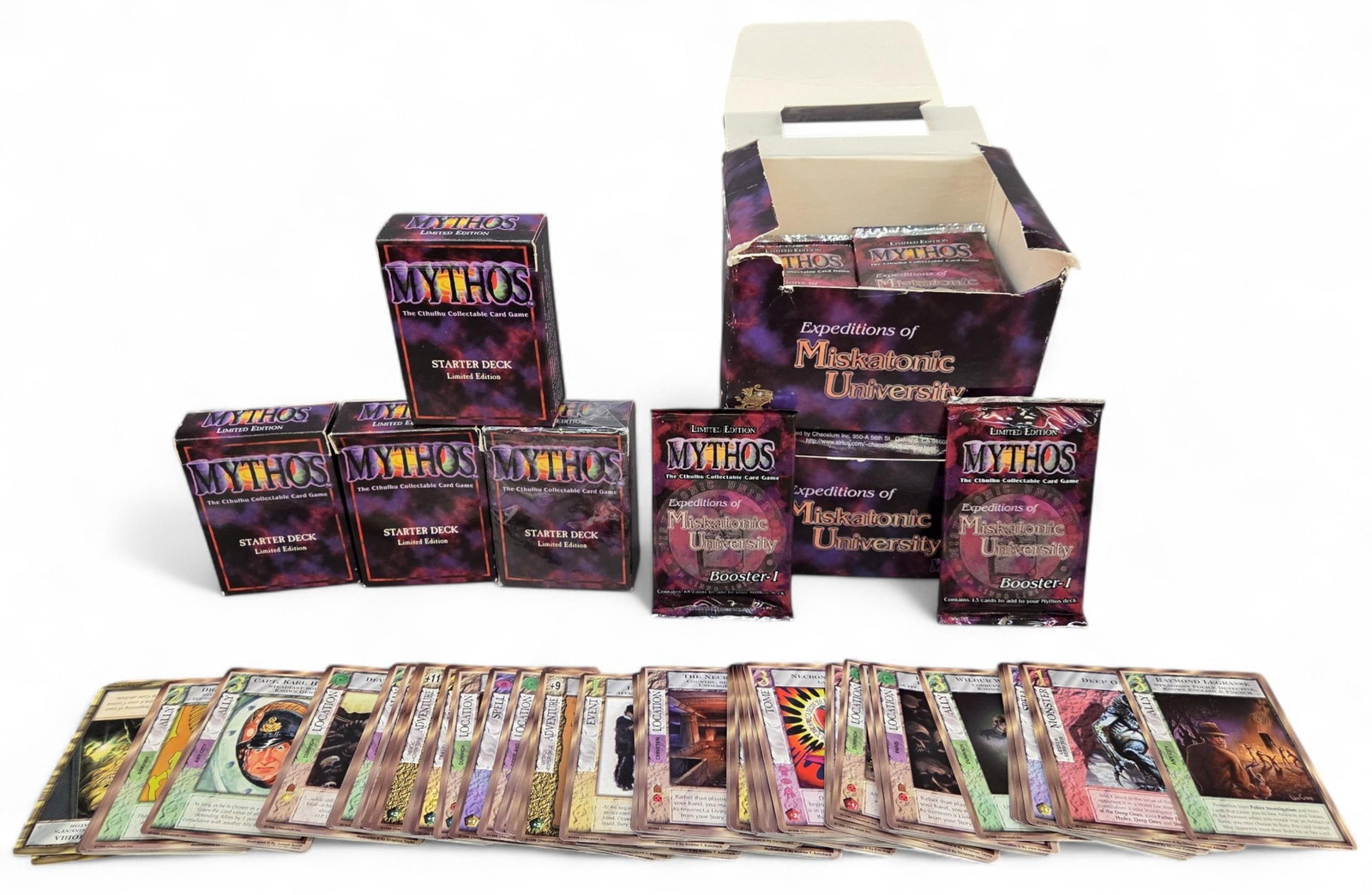 Chaosium "Mythos" TCG boosters, cards, & starters: A group of 1996 Chaosium Inc "Mythos" TCG boosters, cards, and starter decks. ++ Four Mythos: Limited Edition four starter decks, one sealed, and 100 loose cards. ++ forty one Mythos: Expeditions of M