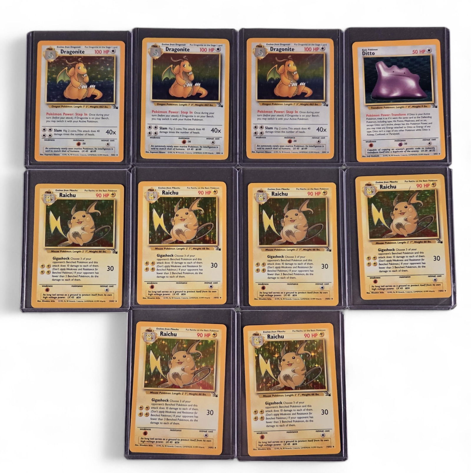 PTCG Fossil [Ultd] holo Dragonite, Ditto, & Raichu: A group of ten Pokemon TCG Fossil [Unlimited] holofoil cards. Three Dragonite, Ditto, and six Raichu.