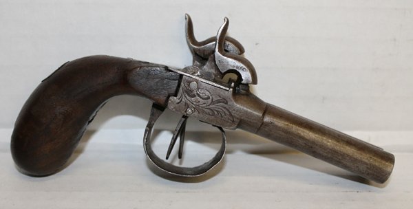 Belgian Side by side percussion cap pistol.: 19th century Belgian made. Various marks including "ELG" with a star on left side. One side mechanically functional. 7"l. This firearm is defined as "Antique" by the BATF.