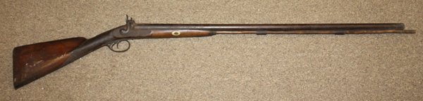 Percussion cap double barrel rifle.: Includes ramrod. 50"l overall. This firearm is defined as "Antique" by the BATF.