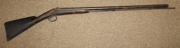 Percussion cap double barrel rifle.: 48"l overall. Condition: Non functioning. This firearm is defined as "Antique" by the BATF.