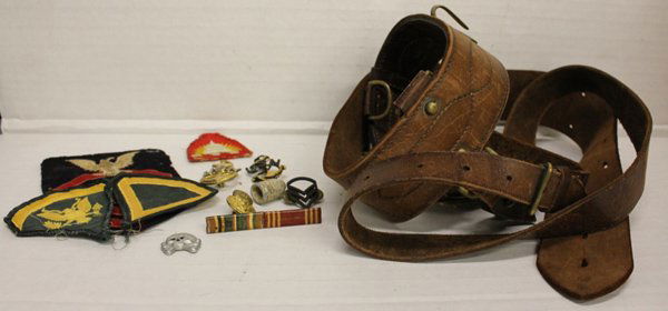 Group of asst pins, medals, leather belt, spats.: Group includes assorted Navy badges and pins as well as single excavated bullet, and Nazi SS skull hat pin. Leather belt with sword hook owned by Lieutenant William A Walsh. Marked "LaMontagne Limited