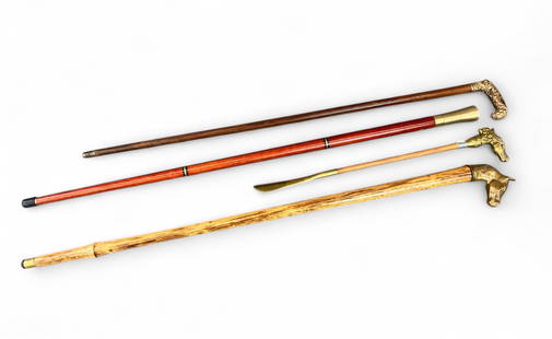 3 canes and shoehorn. Lt. General James R. Brown: A group of three canes and a shoehorn belonging to Lt. Gen. James R. Brown, USAF, including ++ A late 19th century hardwood cane with ornate gilt metal handle decorated with scrolling motifs,