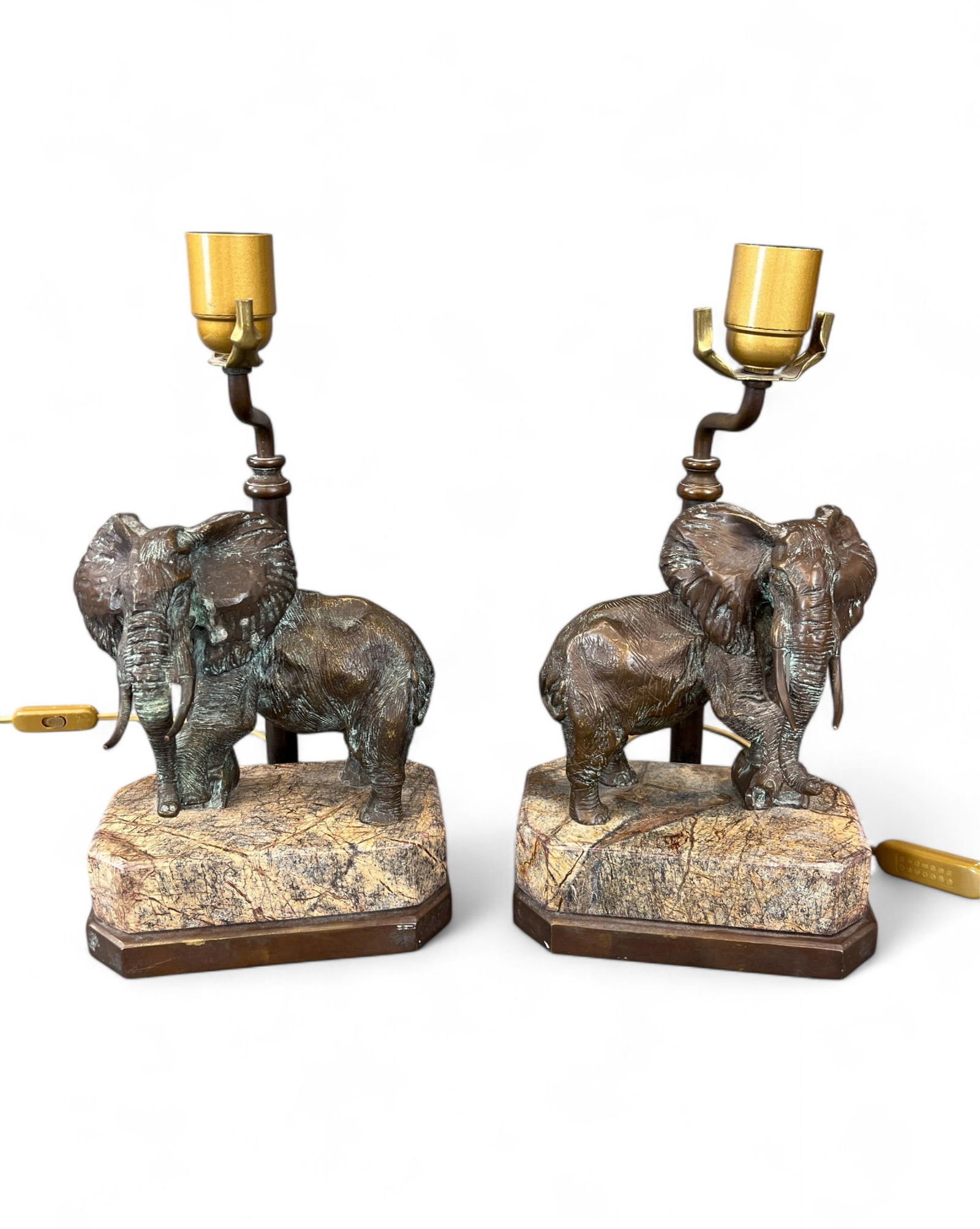 Bronze Elephant Lamps, Lt. Gen. James R. Brown: A pair of bronze elephant figures mounted on granite bases, each with electrical fittings and accompanied by black lamp shades. Base: 13 3/4" x 71/2". Condition: Verdigris, wear. Provenance: From the