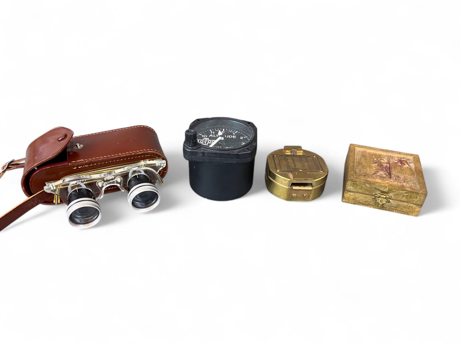 Navigational & Optical Instruments Gen. Jms Brown.: A group of Navigational and Optical Instruments belonging to Lt. Gen. James R. Brown, USAF. Including a pair of Le Jockey Club opera glasses with case; a military aircraft altimeter; a brass compass m