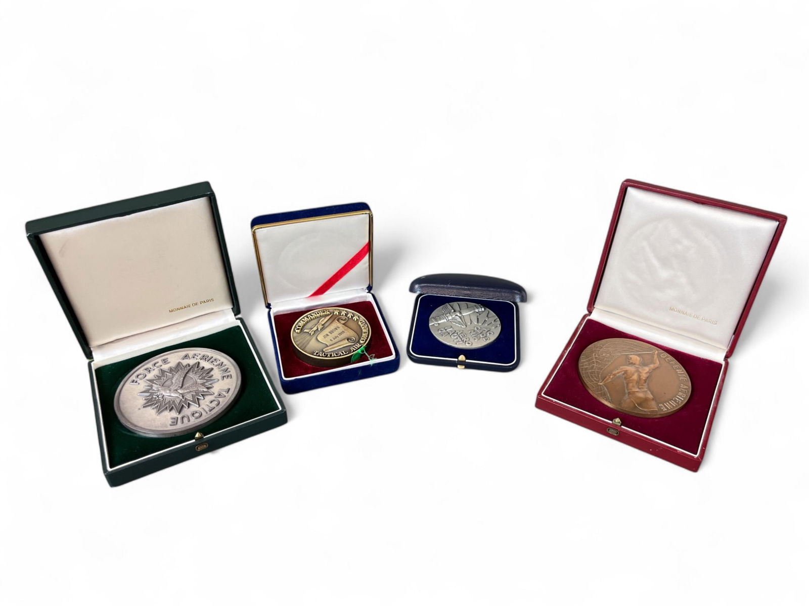 4 named medallions. Lt. Gen. James R. Brown, USAF: A group of four Lt. Gen. James R. Brown, USAF named medallions in cases. Including 1982 Defense Aerienne, 1985 Force Aerienne Tactical, 1988 Tatical Air Command Commander, and 1986 Academia Aeronautic