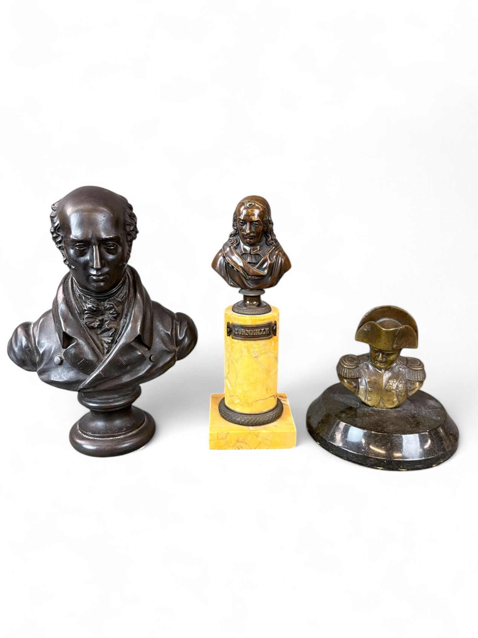 3 Bronze figural busts of gentlemen.: A group of three bronze figural busts of gentlemen. ++ Bust of Pierre Corneille mounted on a column. 19th century. 7 3/4" x 2 3/4". ++ Bust of a gentleman. 19th to 20th century. 7 7/8" x 6 1/4". ++ Bu