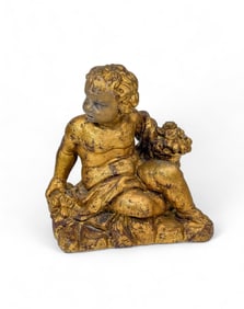Gilt concrete sitting boy.