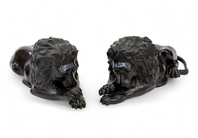 2 Bronze recumbent lions.