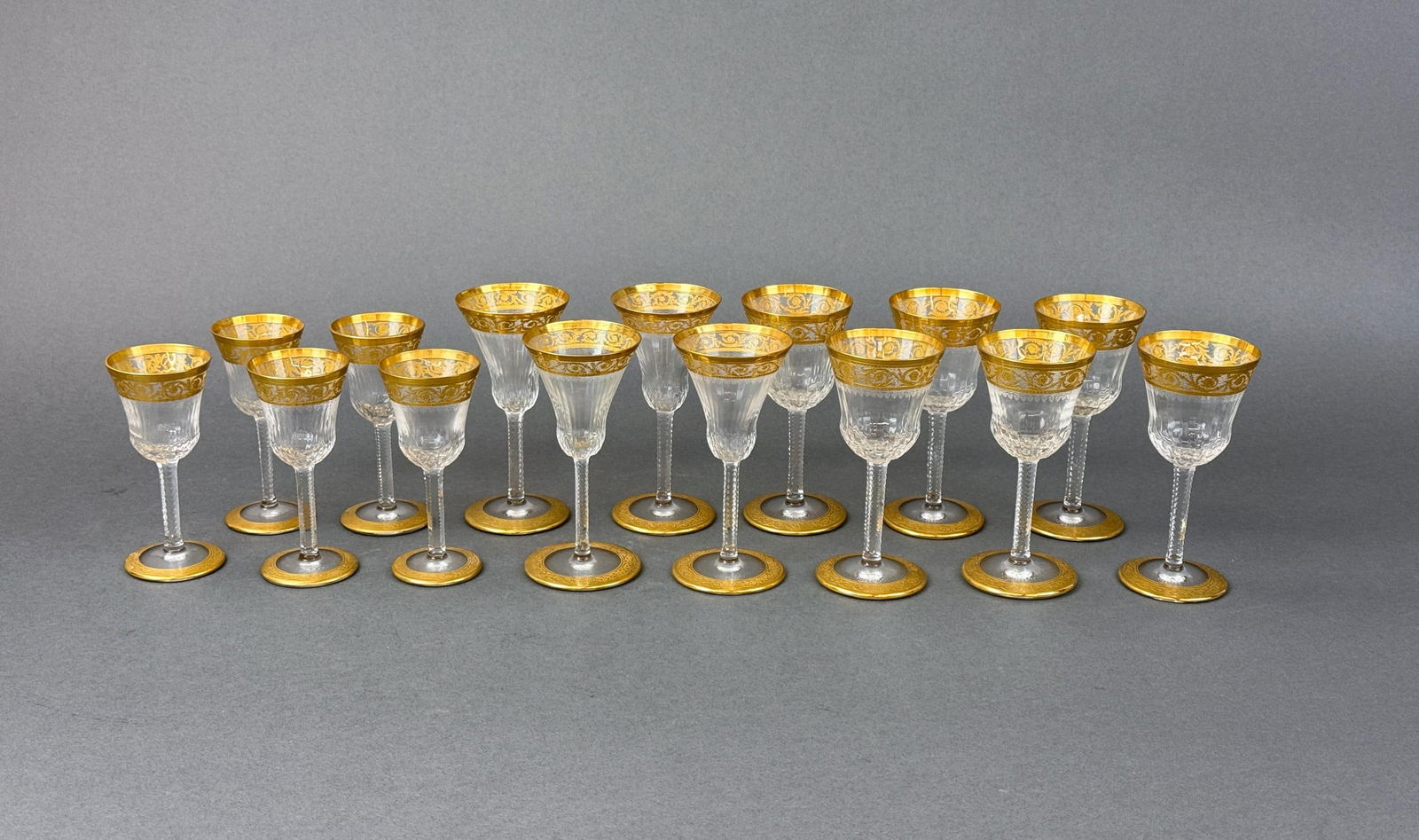 15 St. Louis "Thistle" cordials, port, & sherry: A group of fifteen St. Louis "Thistle" glasses. Including six Port glasses, four sherry glasses, and five cordials. Acid marked on base. Port: 4 3/4" x 2 1/4". Sherry: 4 3/4" x 2 1/4". Cordial: 4 1/4"