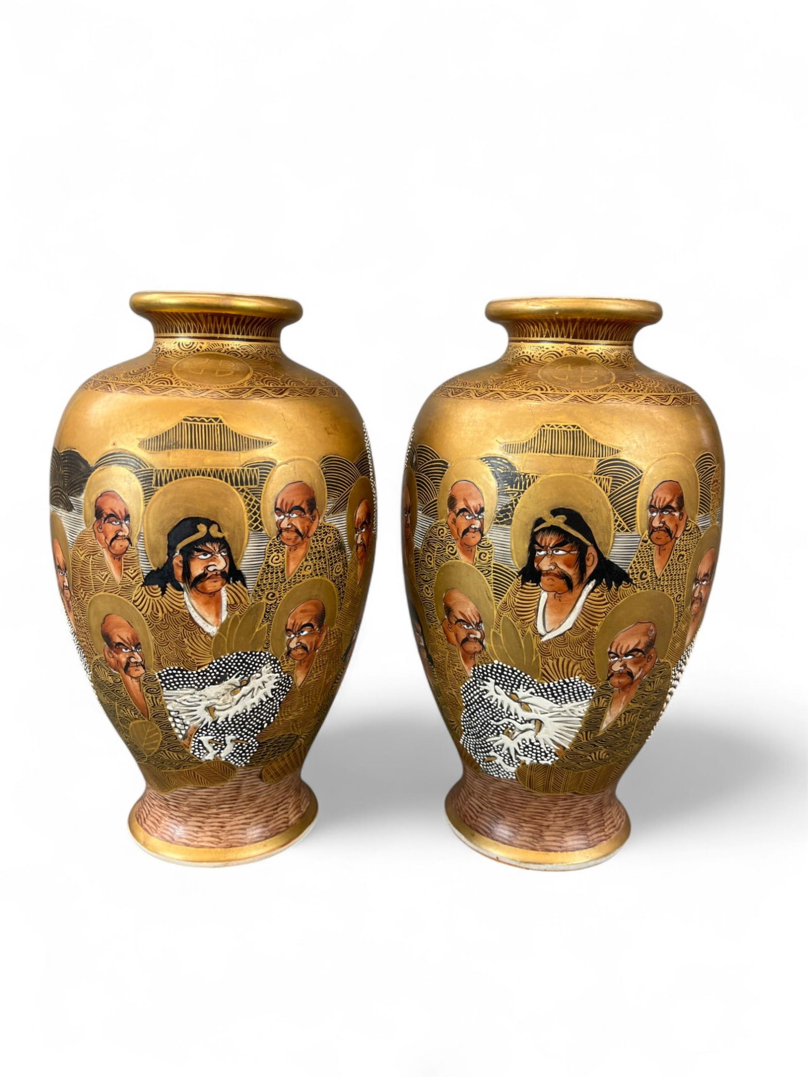 2 Japanese Satsuma vases.: A pair of two Japanese Satsuma vases. Marked on bottom. 8 3/4" x 5". Condition: Crazing, abrasions, pigment loss, and light pitting.