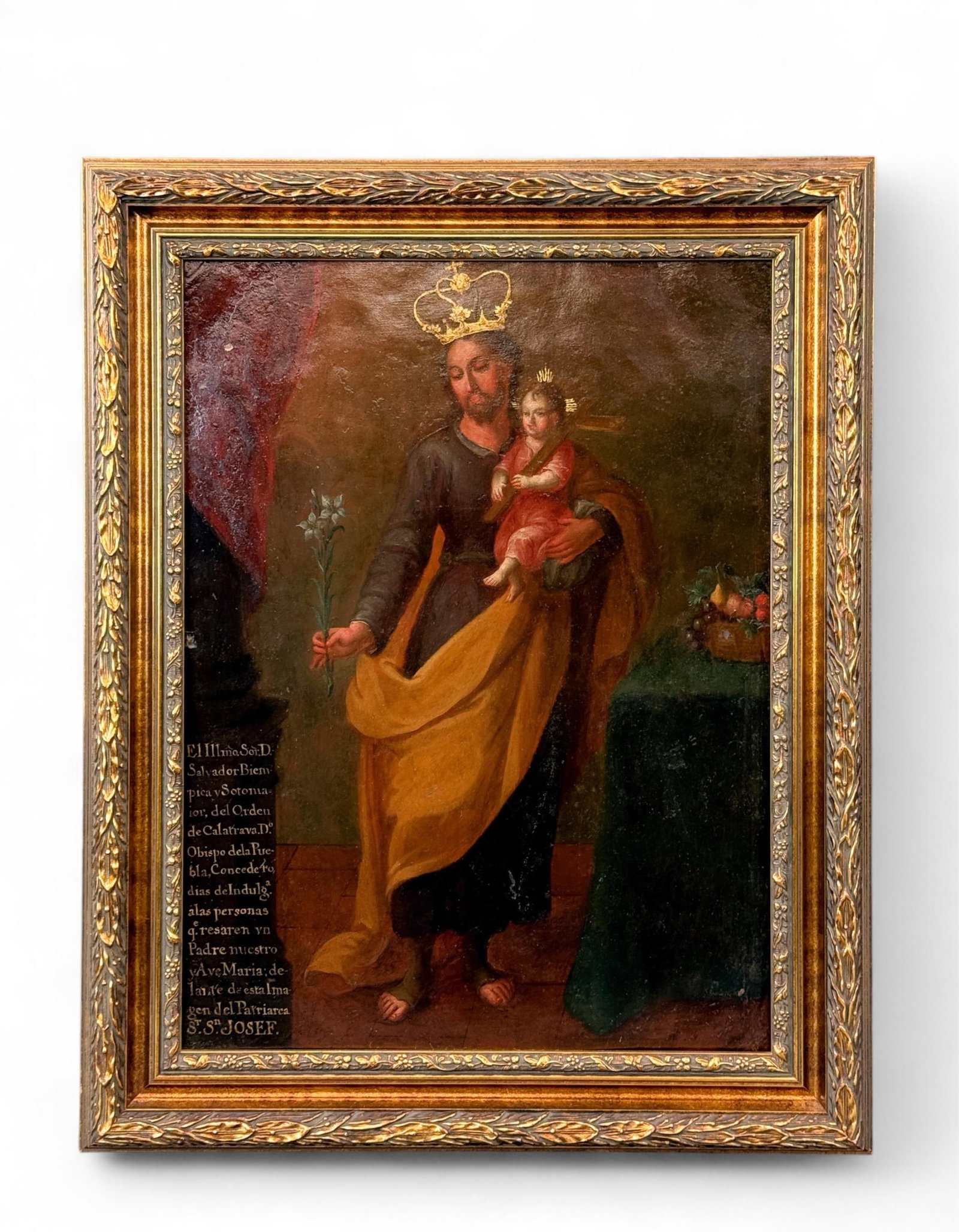 St. Joseph with Christ Child, O/B.: A Spanish Colonial painting of "St. Joseph with the Christ Child." Oil on board. 19th century. Inscription l.l. Sight: 21 1/2" x 16". Frame: 27" x 21 1/4".