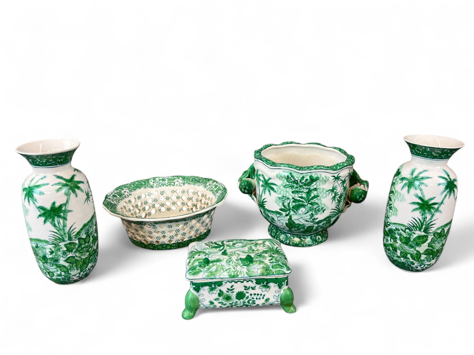 5 Asian porcelain pieces.: A group of five Asian porcelain pieces decorated with flying cherubs and foliage. Includes two vases, one lidded vessel, one reticulated bowl, and one vessel. Marked on bottom. Smallest: 2 3/4" x 5 3/