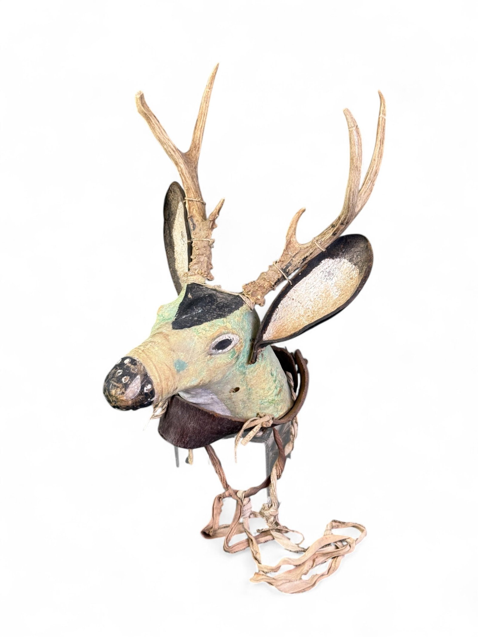 Hopi Jemez deer katsina headdress, 20th c.: A Hopi Jemez deer katsina headdress with animal hide and antelope with horns. Early 20th century. 30" x 12 3/4" x 15 3/4". Provenance: Purchased from Sherwoods in Beverly hills, CA, 26 January 1990.