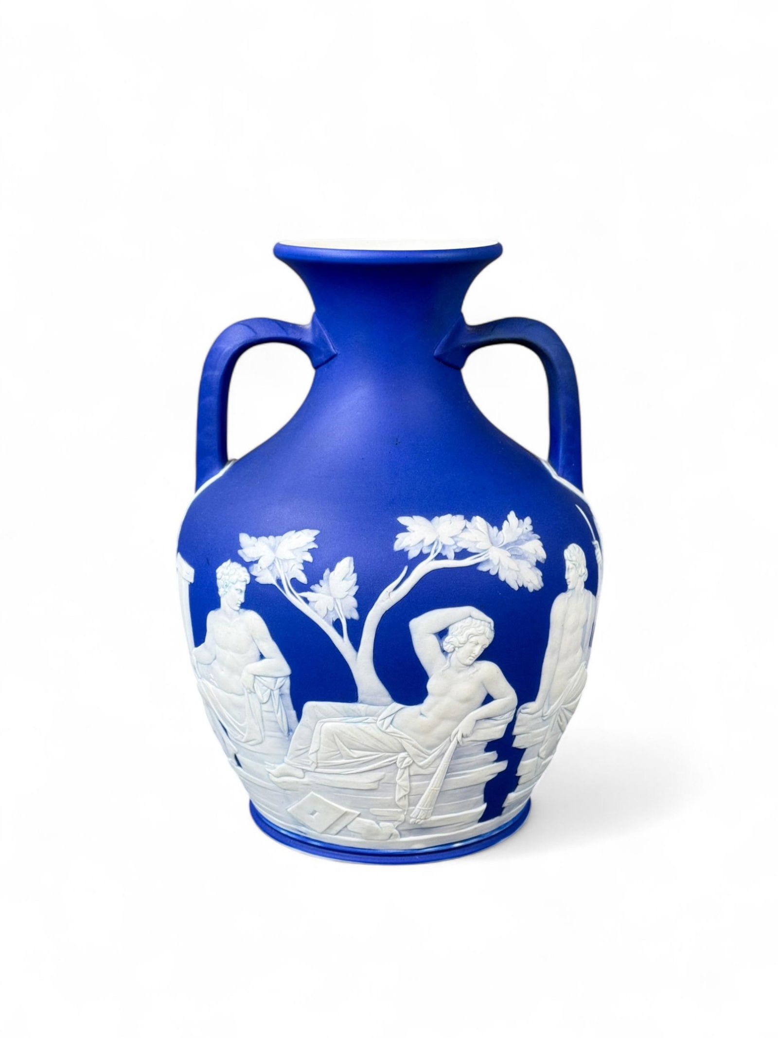 Wedgwood Jasperware 10" royal blue Portland Vase.: A Wedgwood Jasperware royal blue Portland Vase. Late 19th century. Marked on base "WEDGWOOD." 10" x 7 1/2". Condition: Wear on base