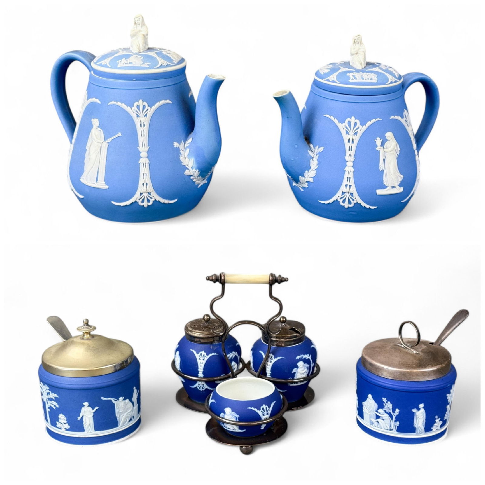 5 Wedgwood Jasperware objects.: A group of five Wedgwood Jasperware objects. Including a set of two blue Wedgwood teapots, a cruet set, and two sugar containers. Late 19th century. Marked "WEDGWOOD." Smallest: 4 1/4" x 4". Largest: