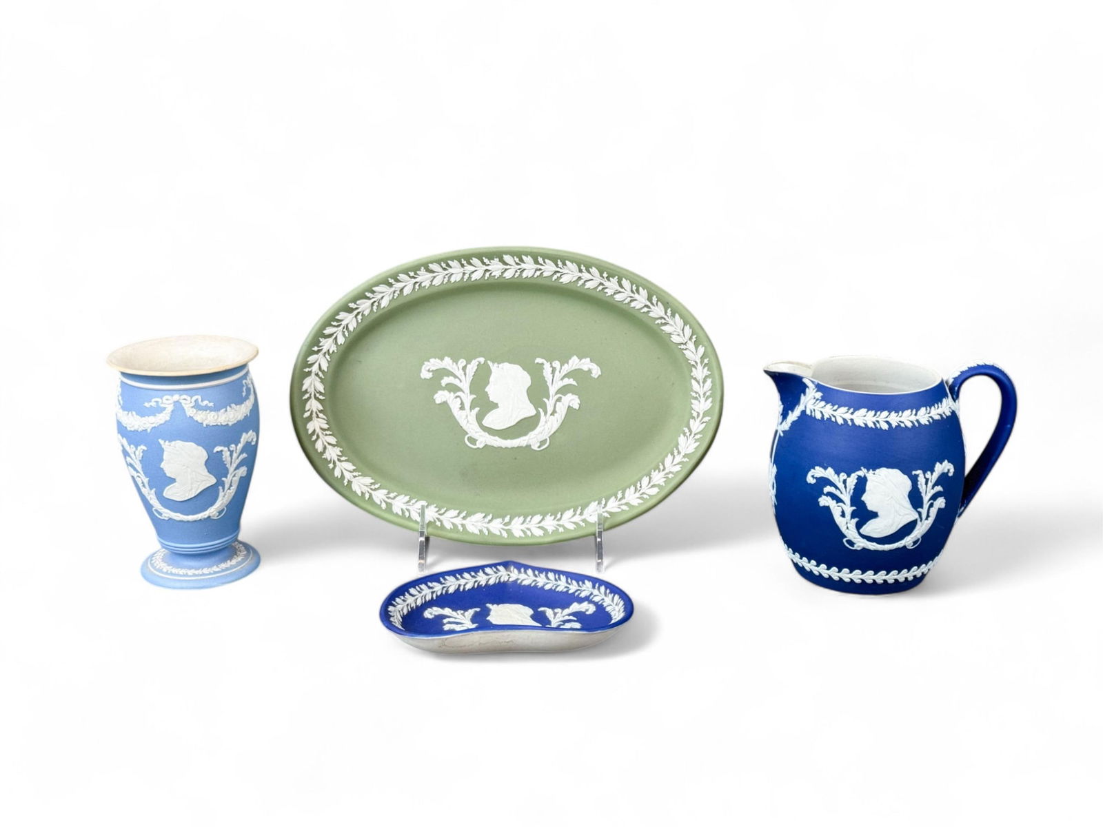 4 Wedgwood Jasperware Queen Victoria pieces.: A group of four Wedgwood Jasperware Queen Victoria pieces. Circa 1892-1901. All marked "WEDGWOOD/ ENGLAND." Smallest: 4 5/8" x 3 1/2" x 5/8". Largest: 9" x 6 1/4" x 3/4".