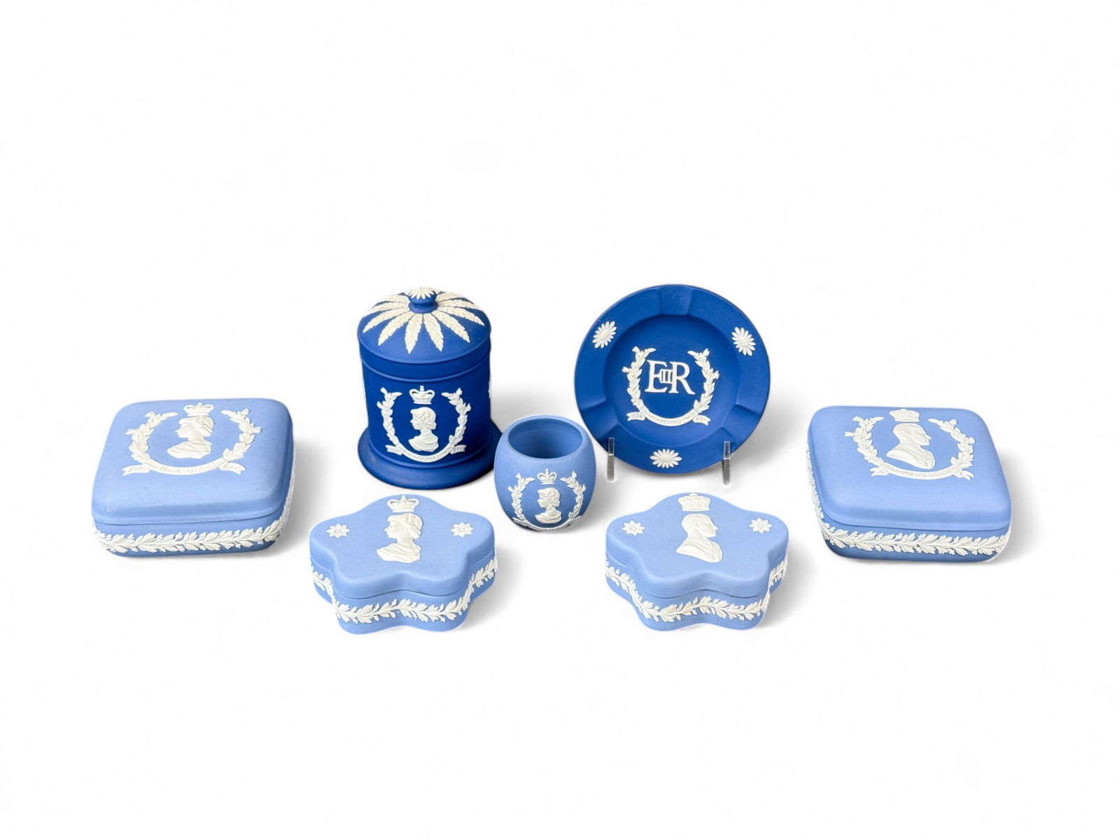 7 Wedgwood Queen Elizabeth II Coronation pieces.: A group of seven Wedgwood Jasperware Queen Elizabeth II Coronation pieces. Smallest: 2" x 2". Largest: 4 1/4" x 3 1/4". Condition: Residue.