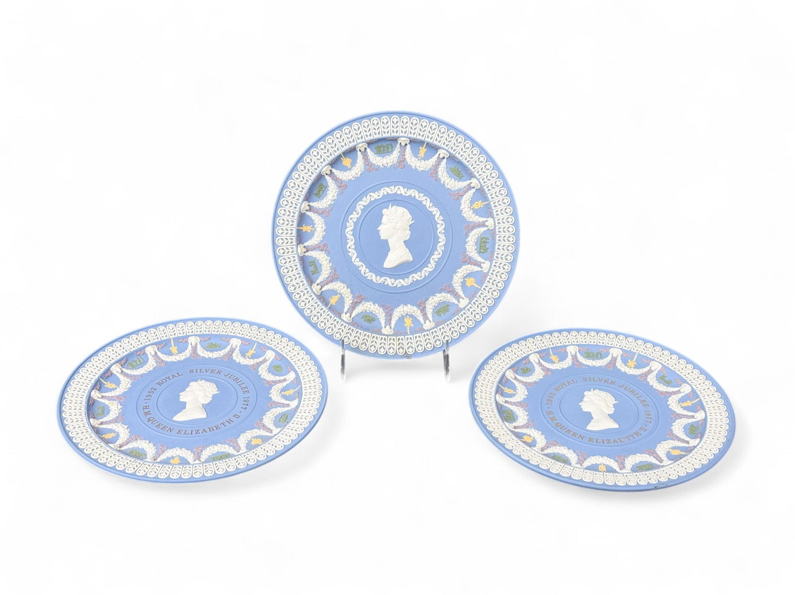 3 Wedgwood Elizabeth II Silver Jubilee plates.: A group of three Wedgwood Jasperware Elizabeth II Silver Jubilee trophy plates. Two Limited Edition plates 621 and 723 of 750. 8 3/4".