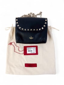 Valentino Garavani Rockstud chain wallet.