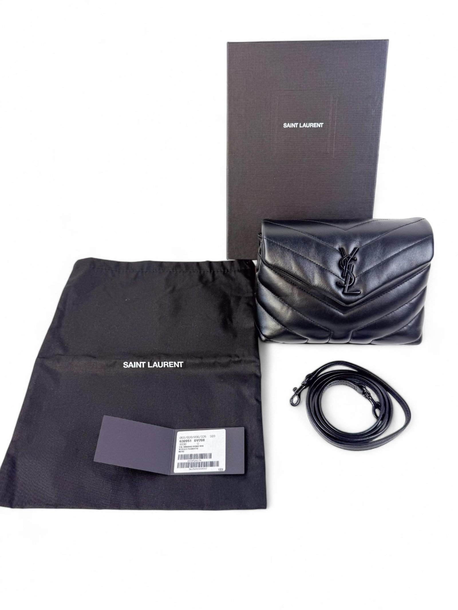 Saint Laurent Loulou puffer shoulder bag.: A black Saint Laurent quilted leather shoulder bag with tonal YSL logo plaque and fold-over flap. Includes box. Condition: Excellent, appears unused.